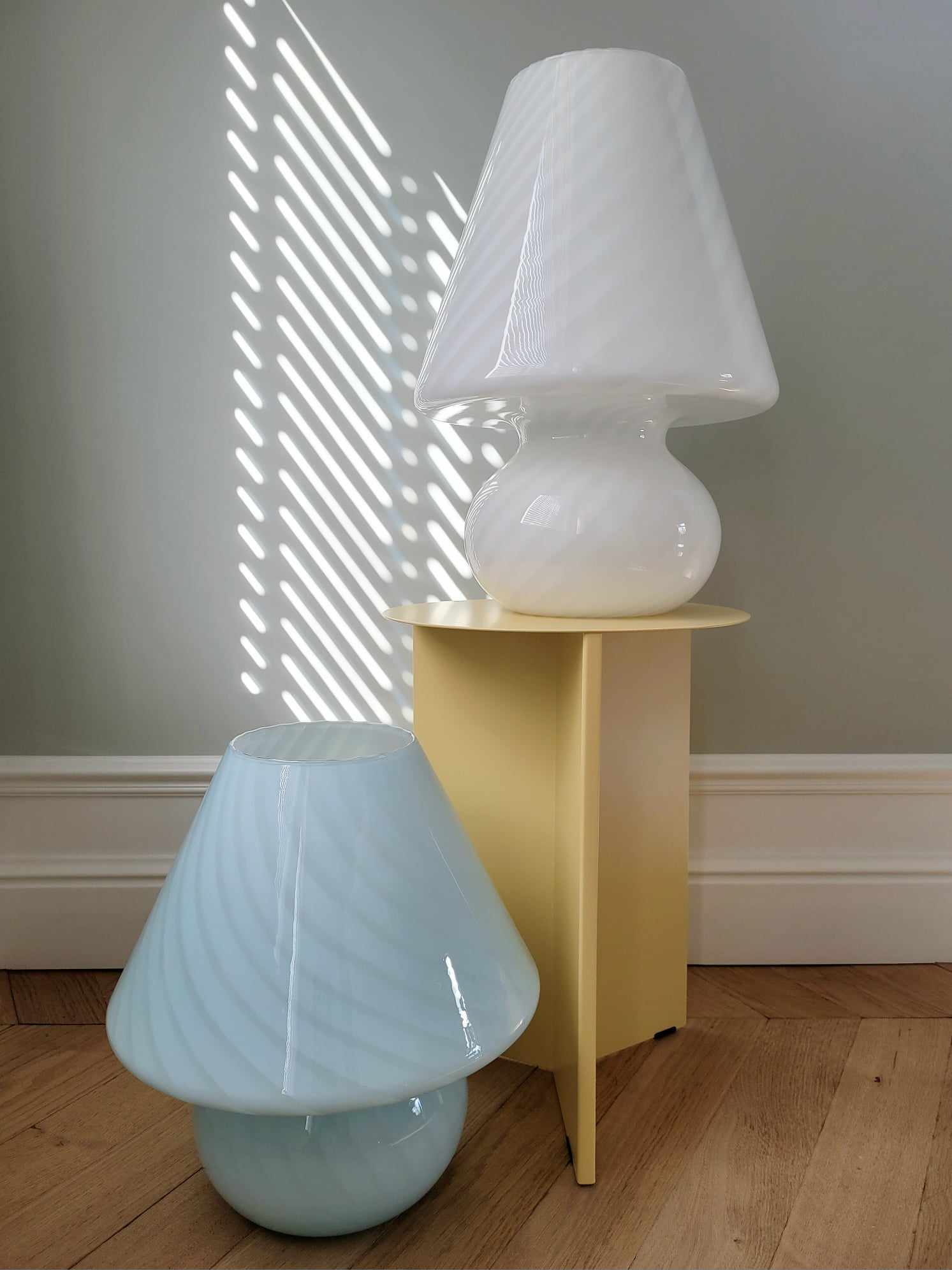 full view of two large vintage Murano white and blue swirl mushroom lamps