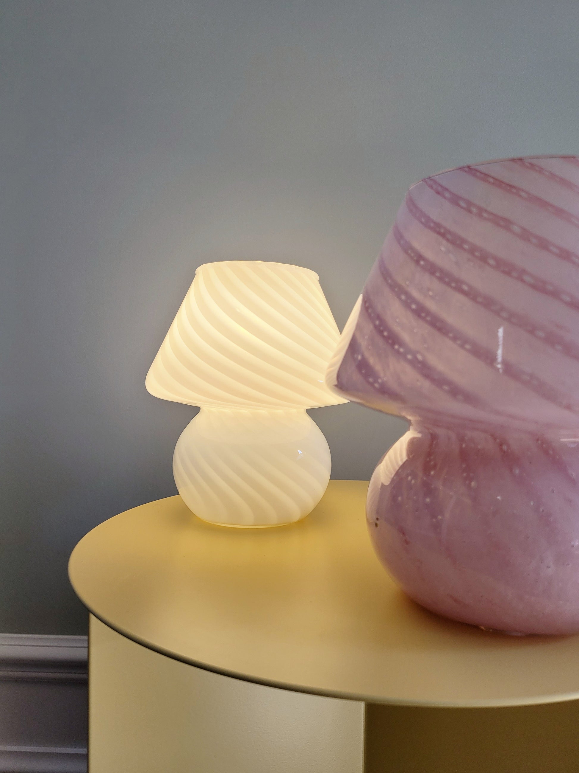 front view of small colourful vintage Murano mushroom table lamps with pink and white swirls