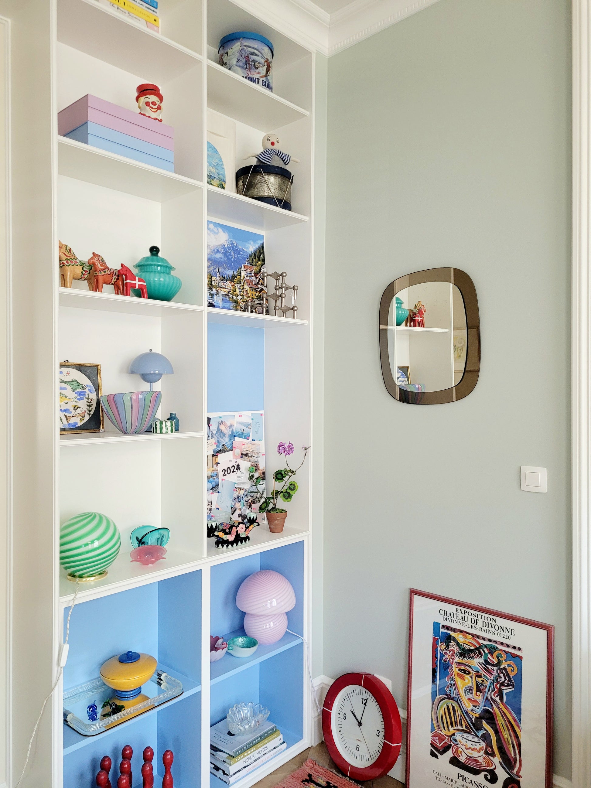 full view of a vintage two-tone Italian wall mirror with smoked glass