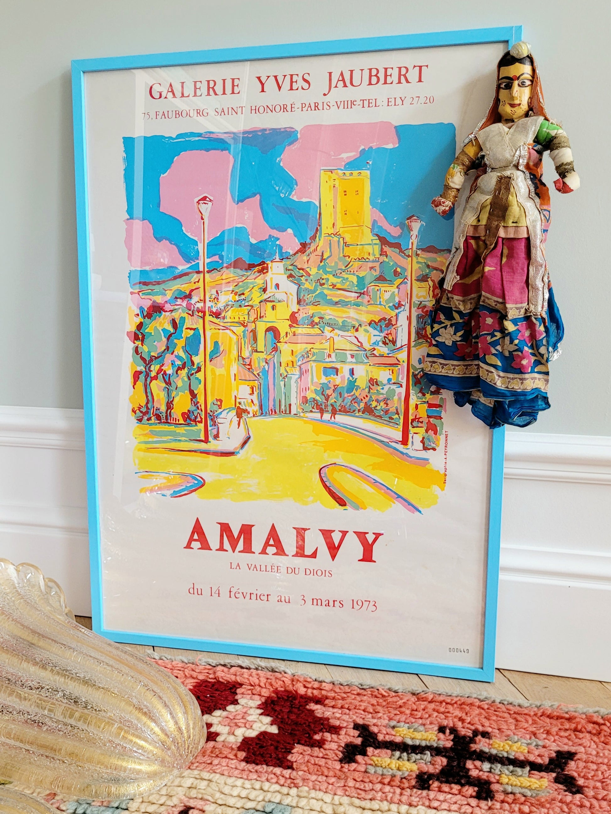 a vintage Asian textile puppet doll in vibrant colours