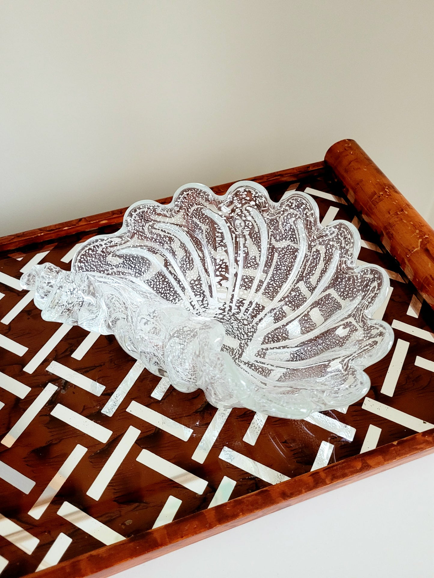 top view of a vintage clear and silver Murano bowl in shell shape 