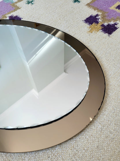 detailed view of an Italian faceted mirror, featuring a rich brown frame