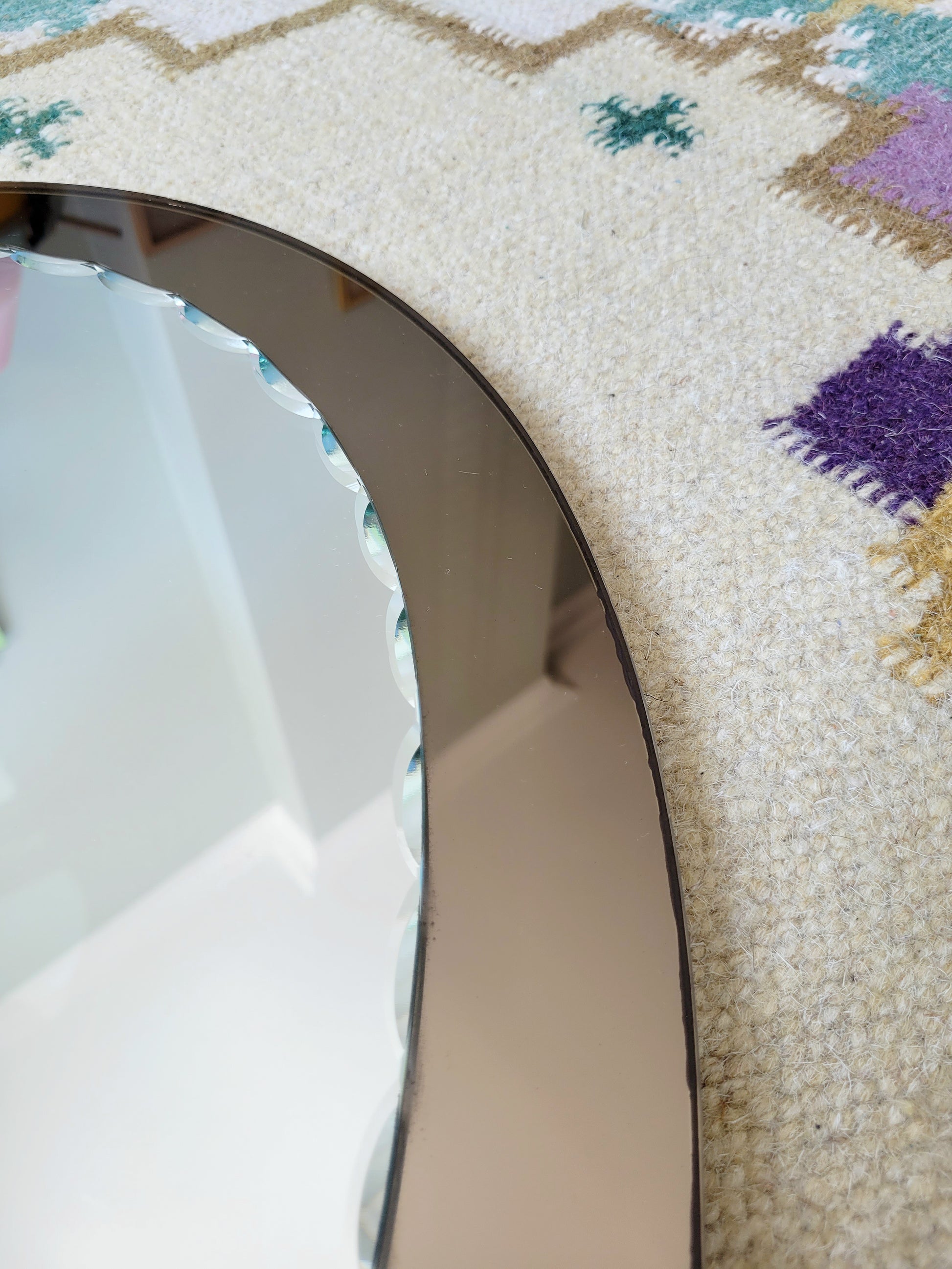 top view of an Italian faceted mirror, featuring a rich brown frame