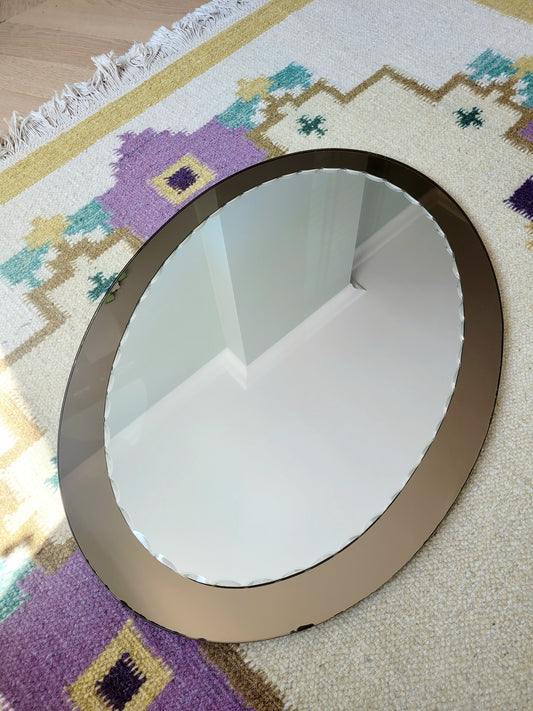 top view of an Italian faceted mirror, featuring a rich brown frame