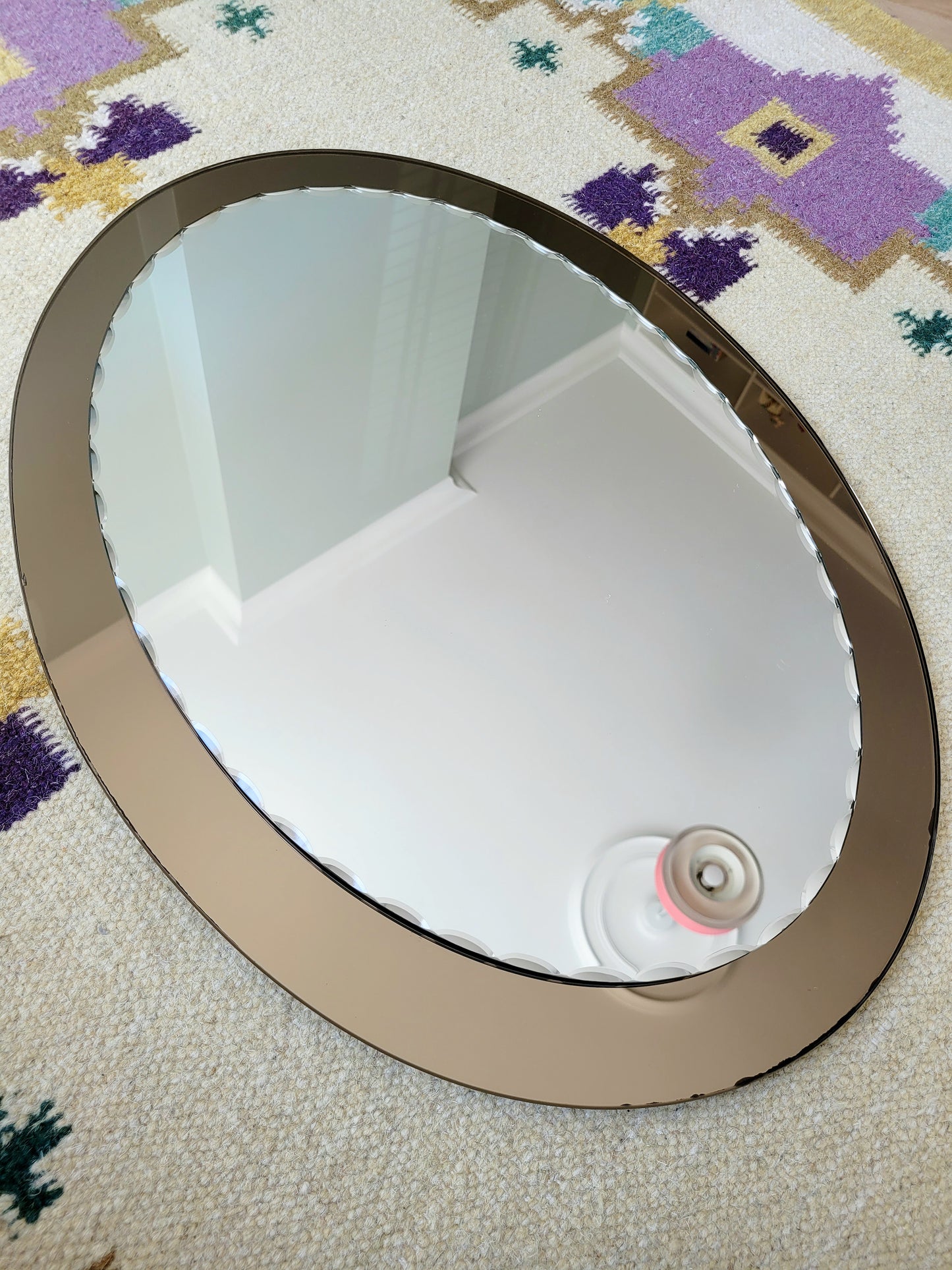 top view of an Italian faceted mirror, featuring a rich brown frame