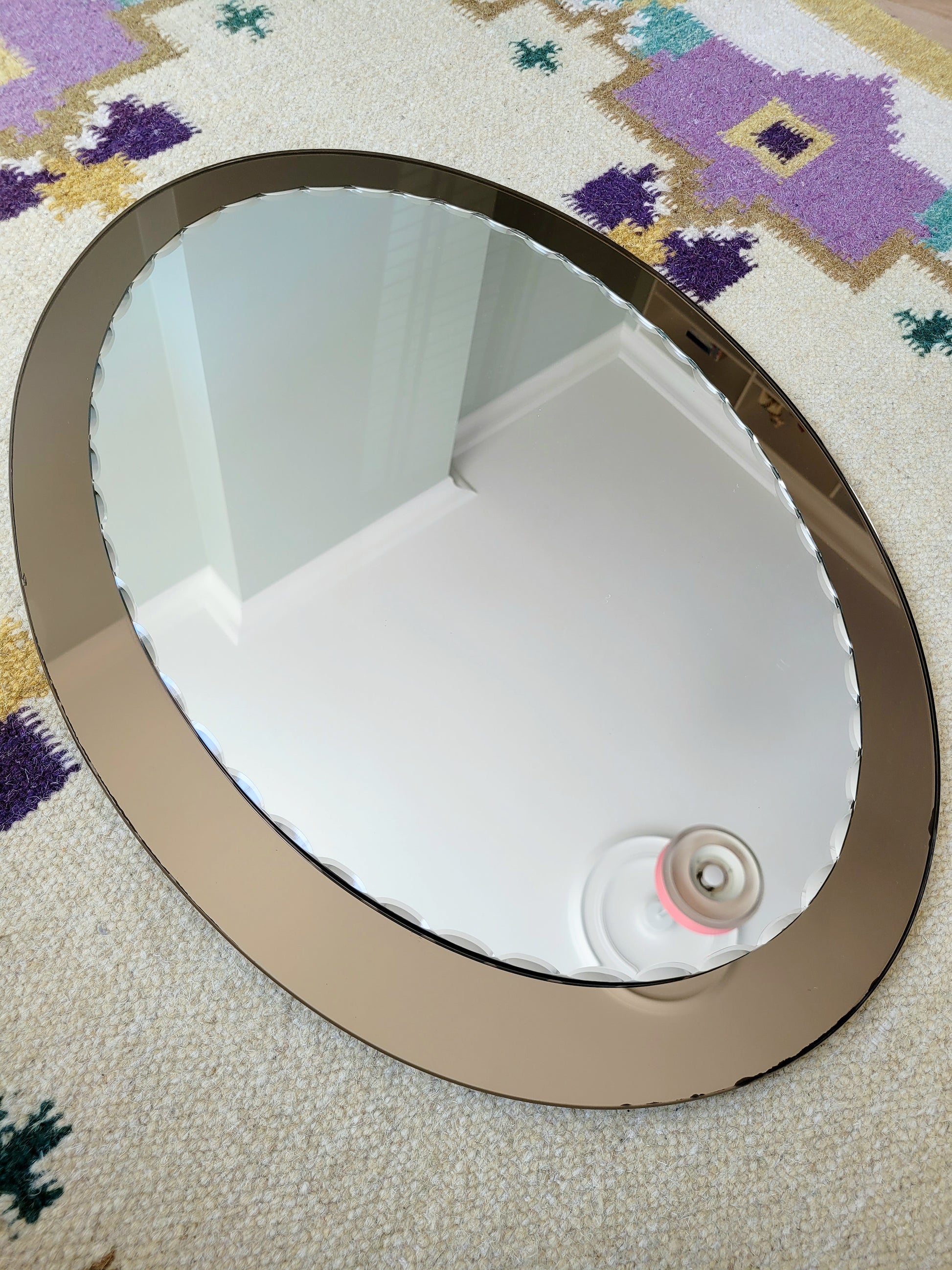 top view of an Italian faceted mirror, featuring a rich brown frame