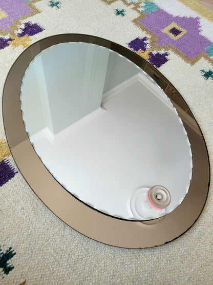 top view of an Italian faceted mirror, featuring a rich brown frame