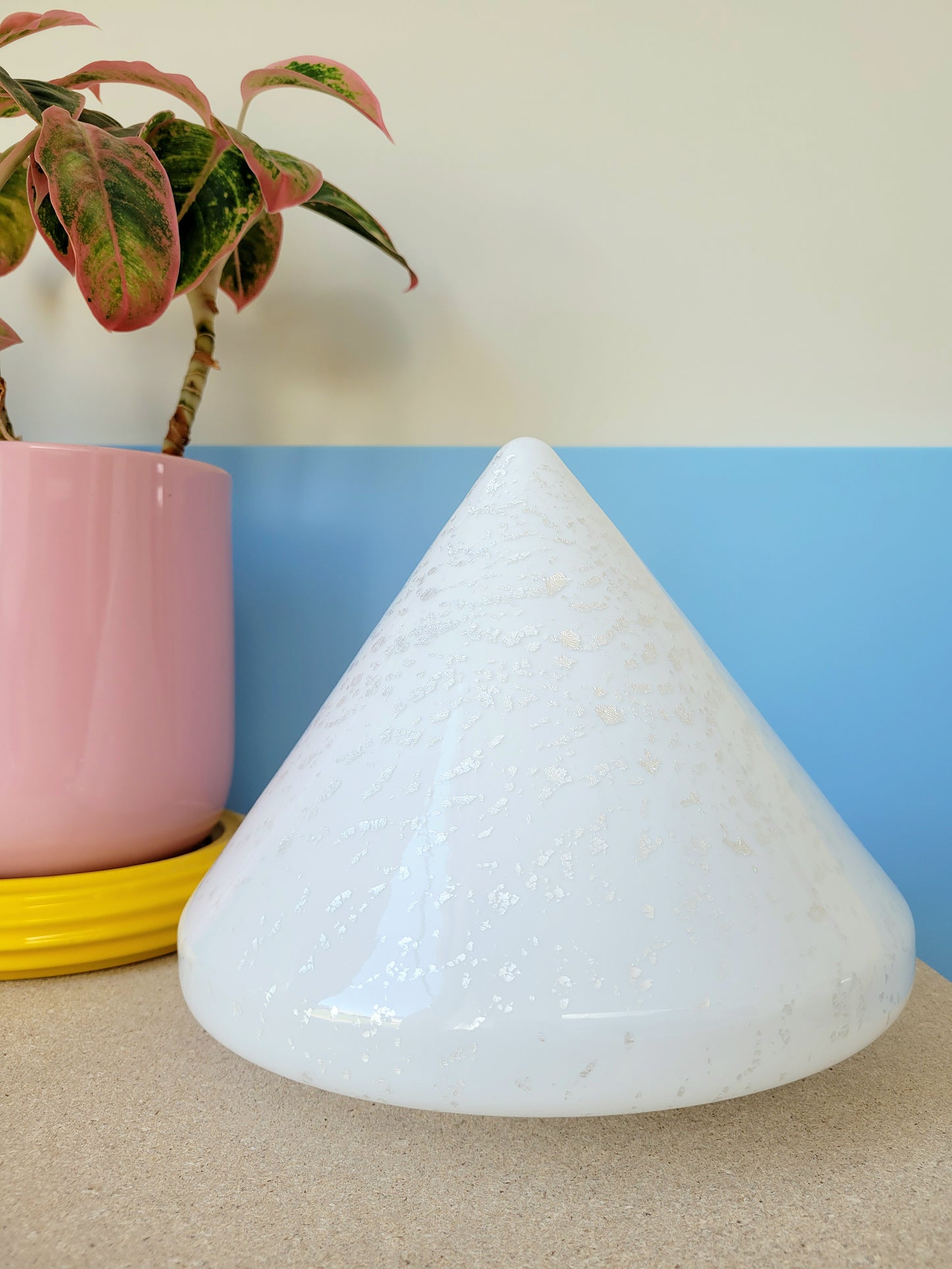 A cone-shaped table lamp made from Murano glass with silver flakes running through it