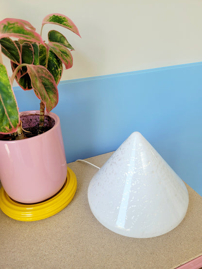 A cone-shaped table lamp made from Murano glass with silver flakes running through it