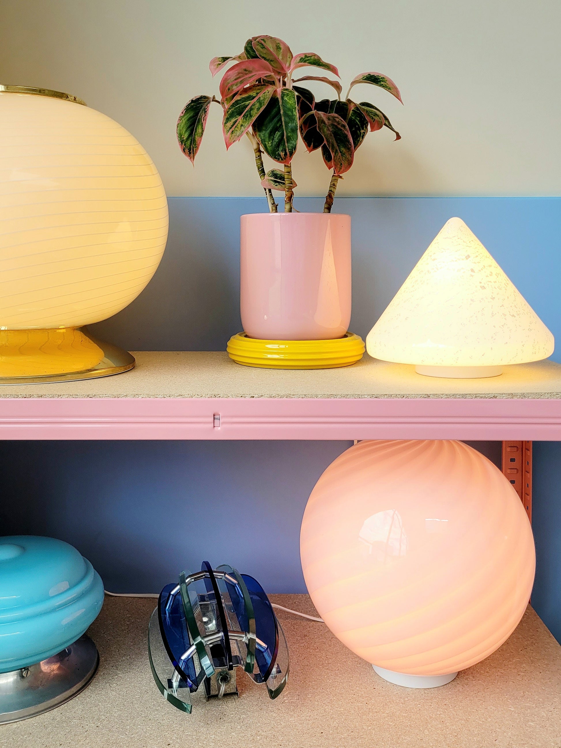 A cone-shaped table lamp made from Murano glass with silver flakes running through it
