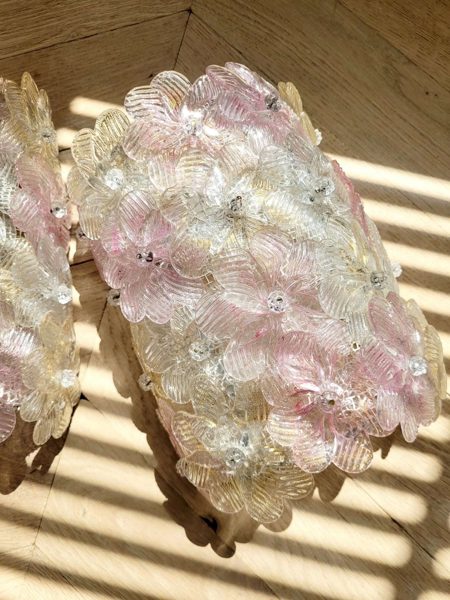 full view of vintage Murano glass flower wall lights with pink, clear and golden petals