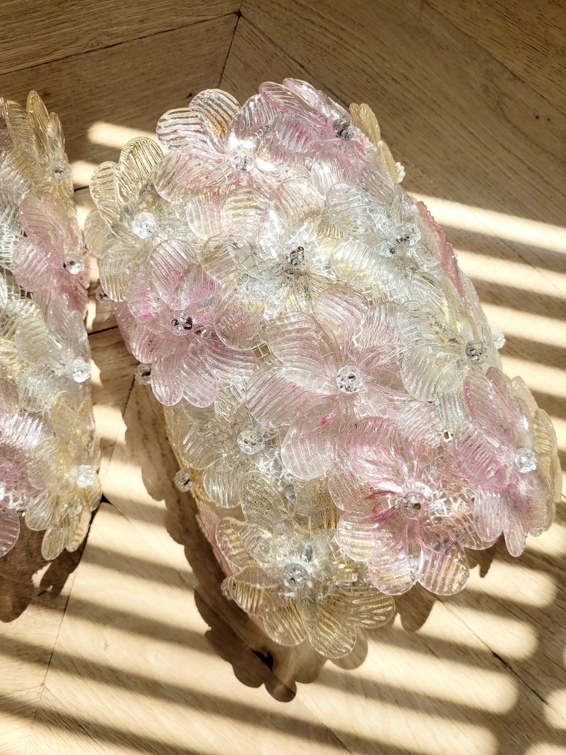 full view of vintage Murano glass flower wall lights with pink, clear and golden petals