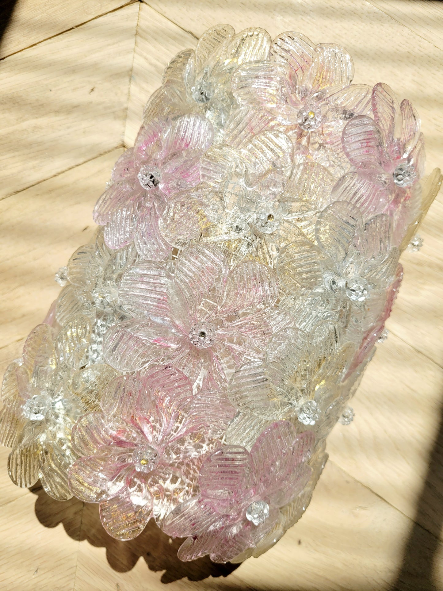 full view of a vintage Murano glass flower wall light with pink, clear and golden petals