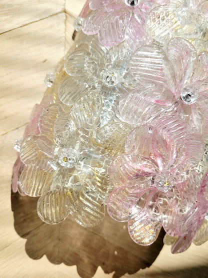 detail of a vintage Murano glass flower wall light with pink, clear and golden petals