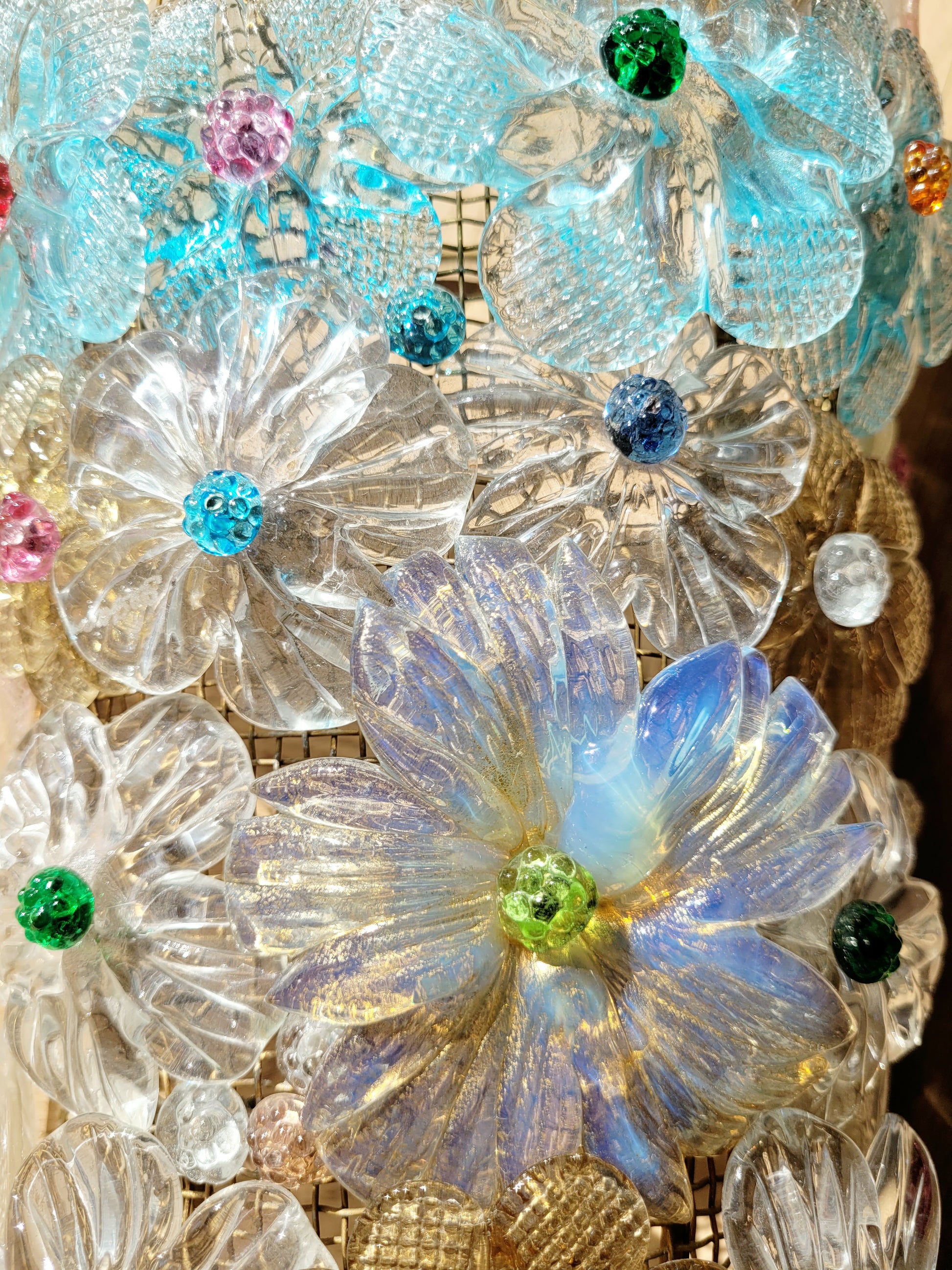 detail of a Seguso vintage Murano flower wall lamp or sconce with colourful glass petals