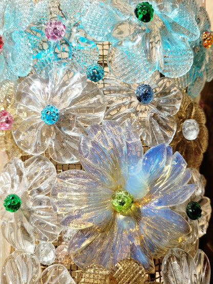 detail of a Seguso vintage Murano flower wall lamp or sconce with colourful glass petals