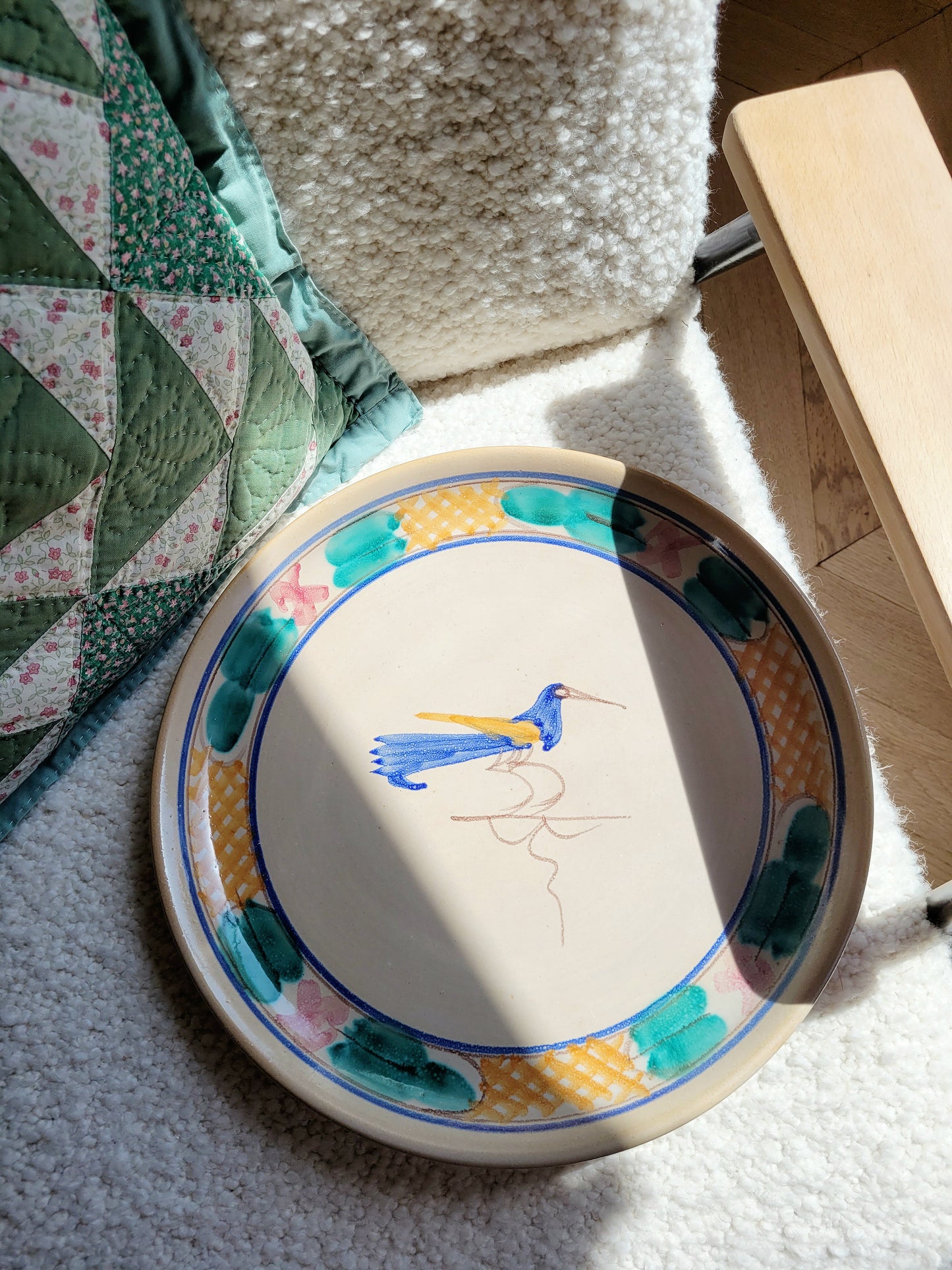 full view of a ceramic (wall) plate from Tuscany with a bird