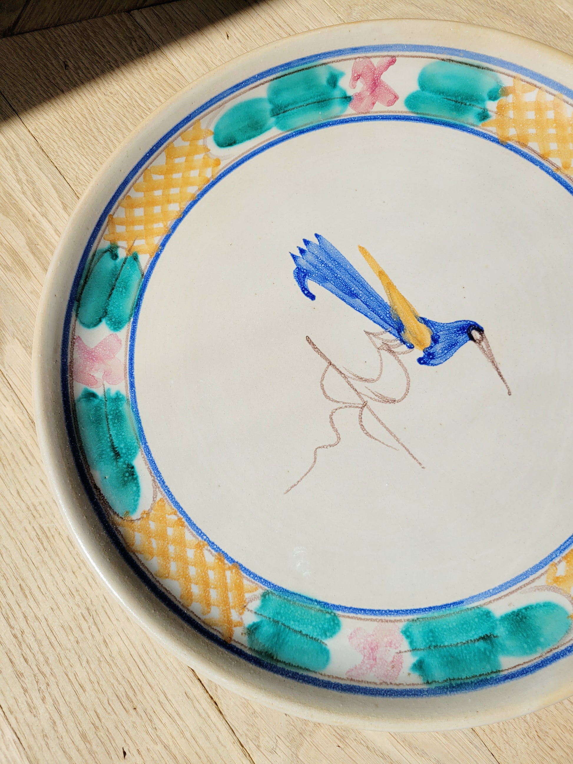 detail of a ceramic (wall) plate from Tuscany with a bird