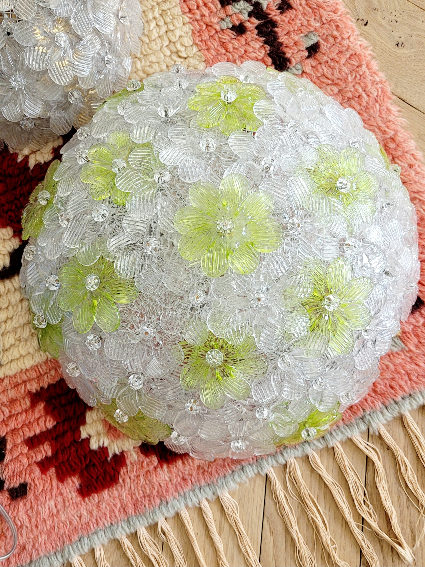 top view of a vintage Murano flower ceiling lamp with clear and green floral petals