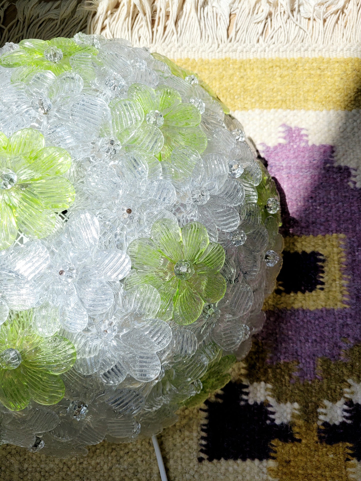 top view of a vintage Murano flower ceiling lamp with clear and green floral petals
