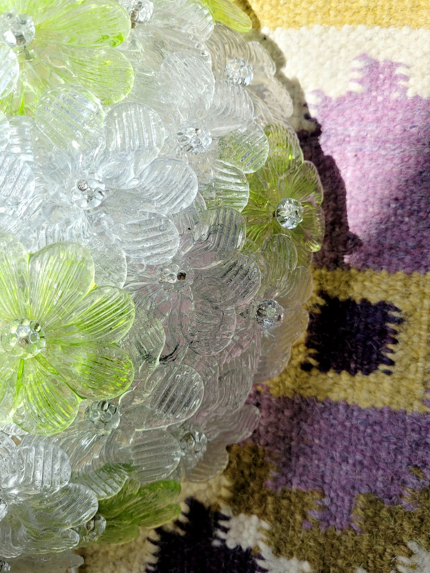 top view of a vintage Murano flower ceiling lamp with clear and green floral petals