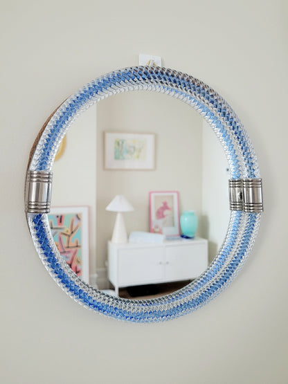 full front view of a vintage Italian mirror with a twisted frame of vibrant blue Murano glass