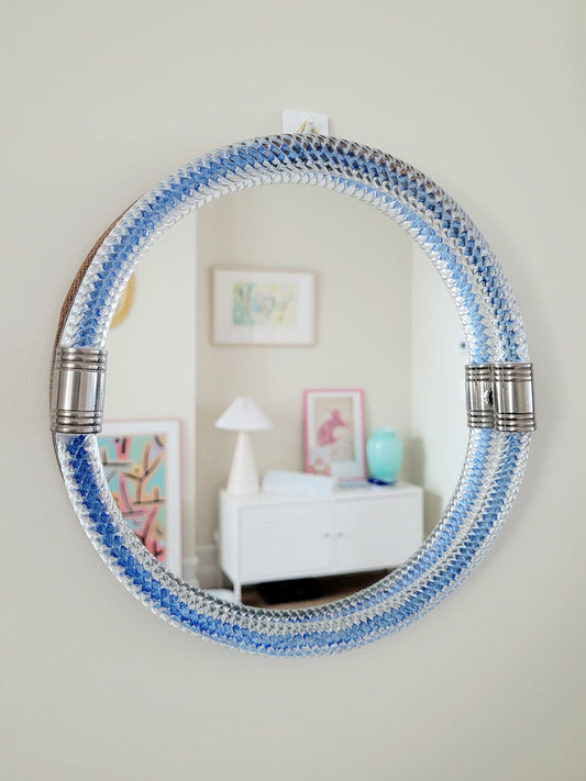 full front view of a vintage Italian mirror with a twisted frame of vibrant blue Murano glass