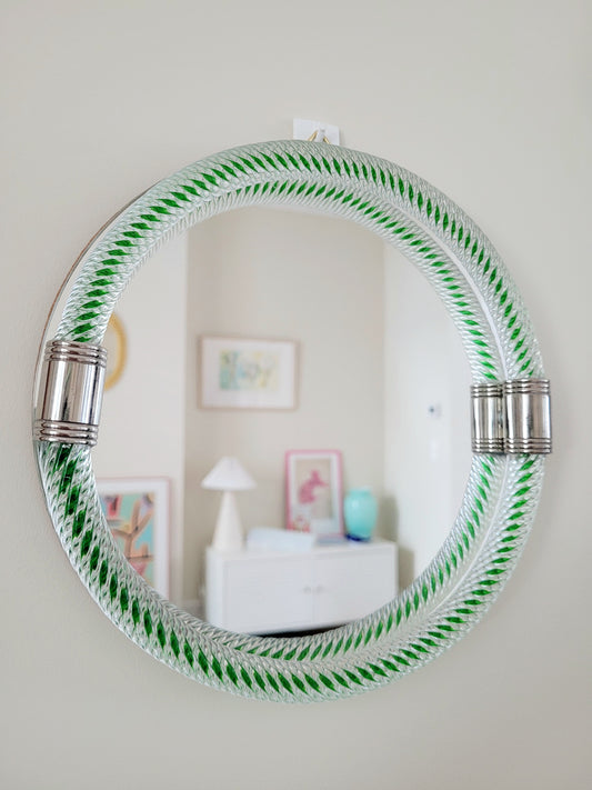 full front view of an Italian round mirror with a twisted green glass frame