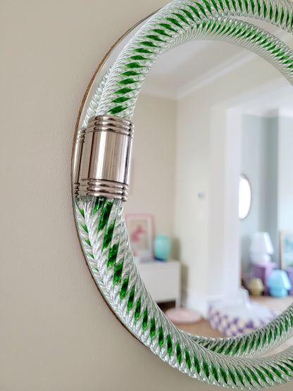 detailed view of an Italian round mirror with a twisted green glass frame