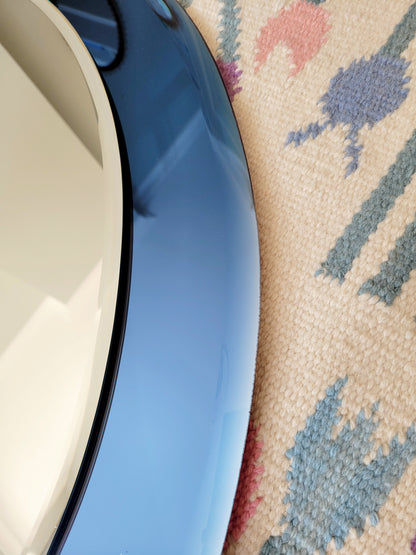 Italian mirror featuring a distinctive light blue frame