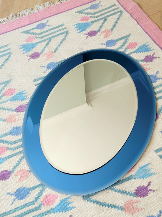 Italian mirror featuring a distinctive light blue frame