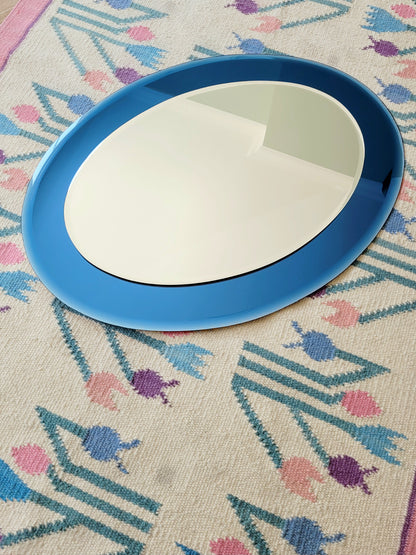 Italian mirror featuring a distinctive light blue frame
