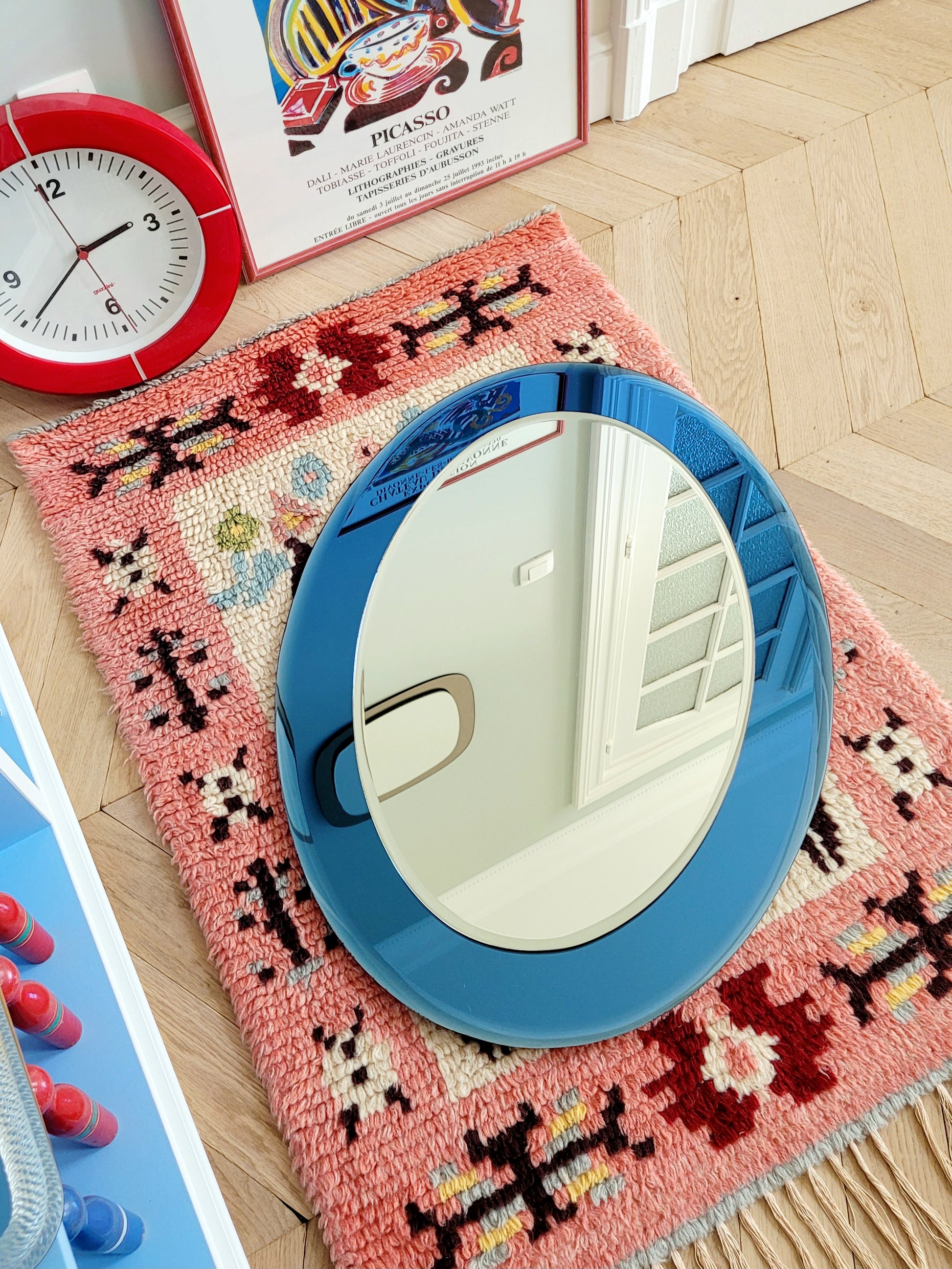 Italian mirror featuring a distinctive light blue frame