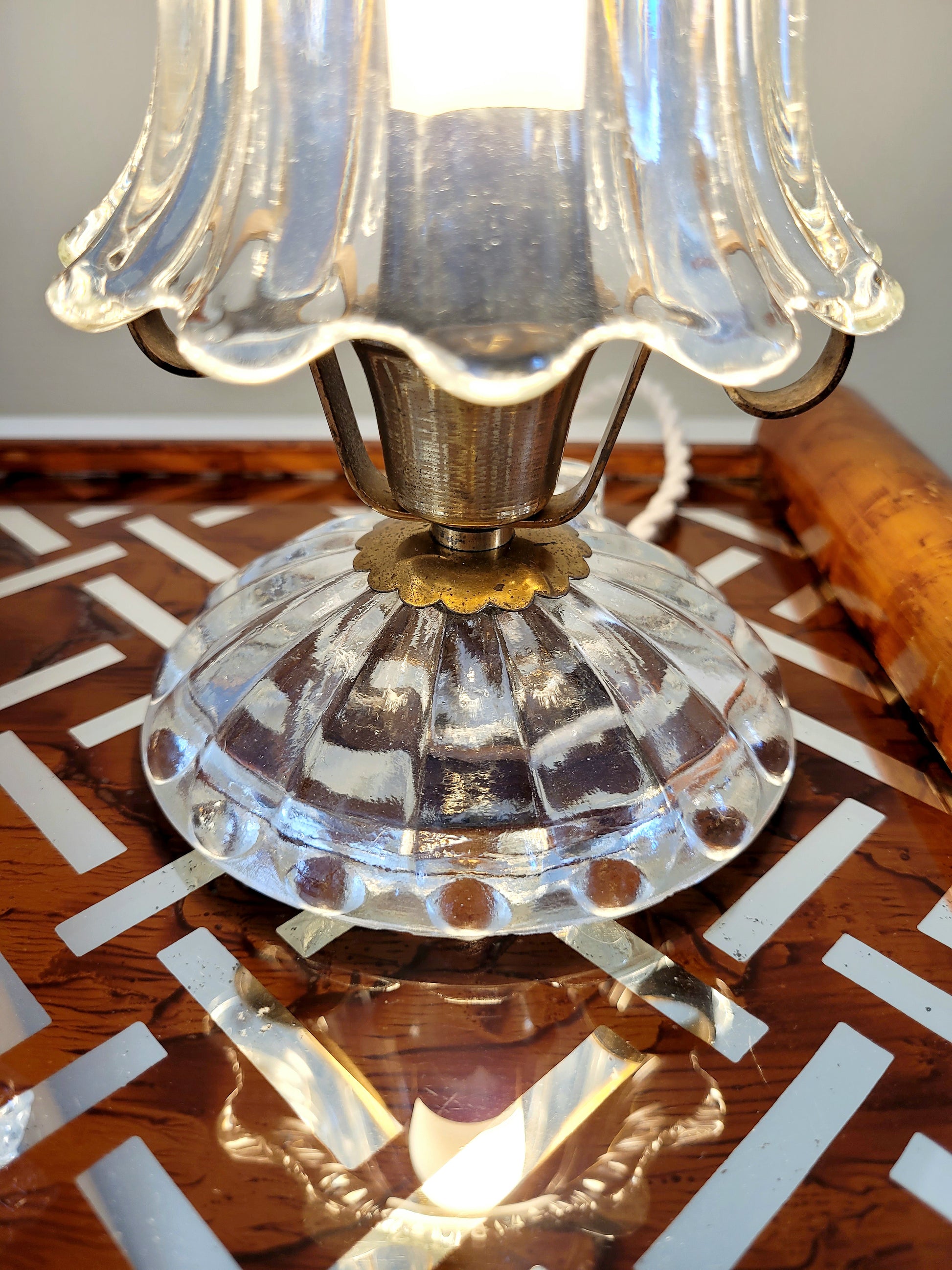 detail of a vintage Murano glass and brass table lamp