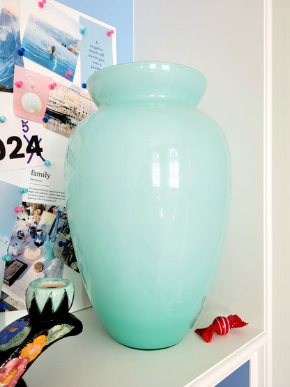 full view of a vintage Murano vase with a glossy aquamarine-mint green exterior over a soft milk-white opaline interior