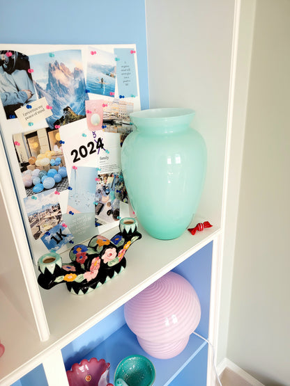 full view of a vintage Murano vase with a glossy aquamarine-mint green exterior over a soft milk-white opaline interior