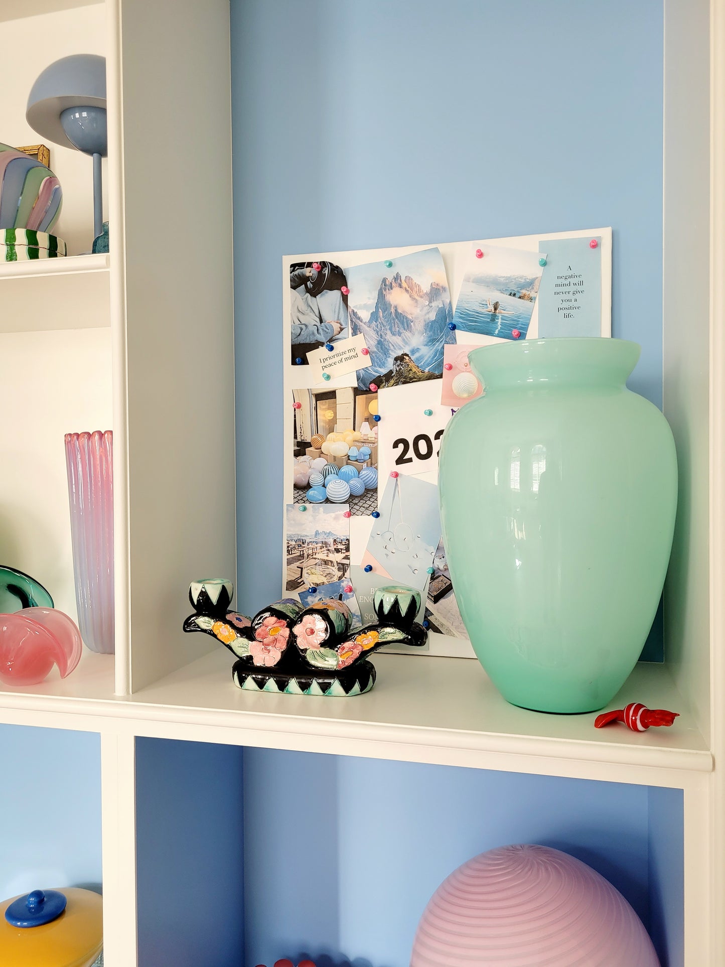 full view of a vintage Murano vase with a glossy aquamarine-mint green exterior over a soft milk-white opaline interior