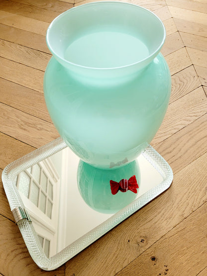 top view of a vintage Murano vase with a glossy aquamarine-mint green exterior over a soft milk-white opaline interior
