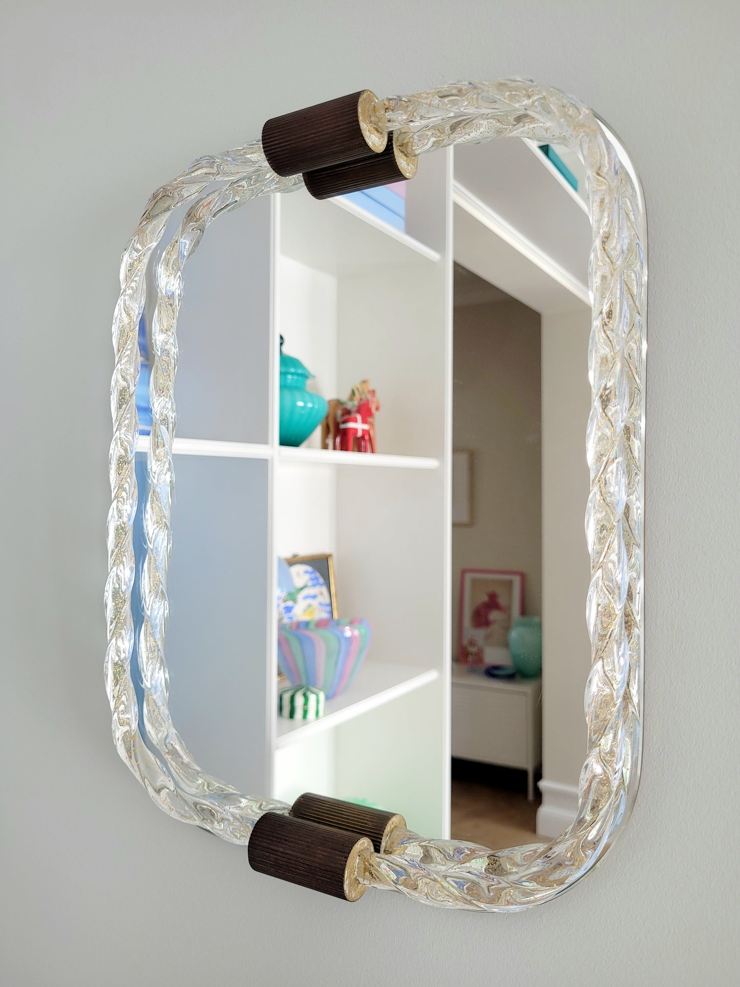 vintage Italian mirror, accentuated by a twisted frame of clear/golden Murano glass