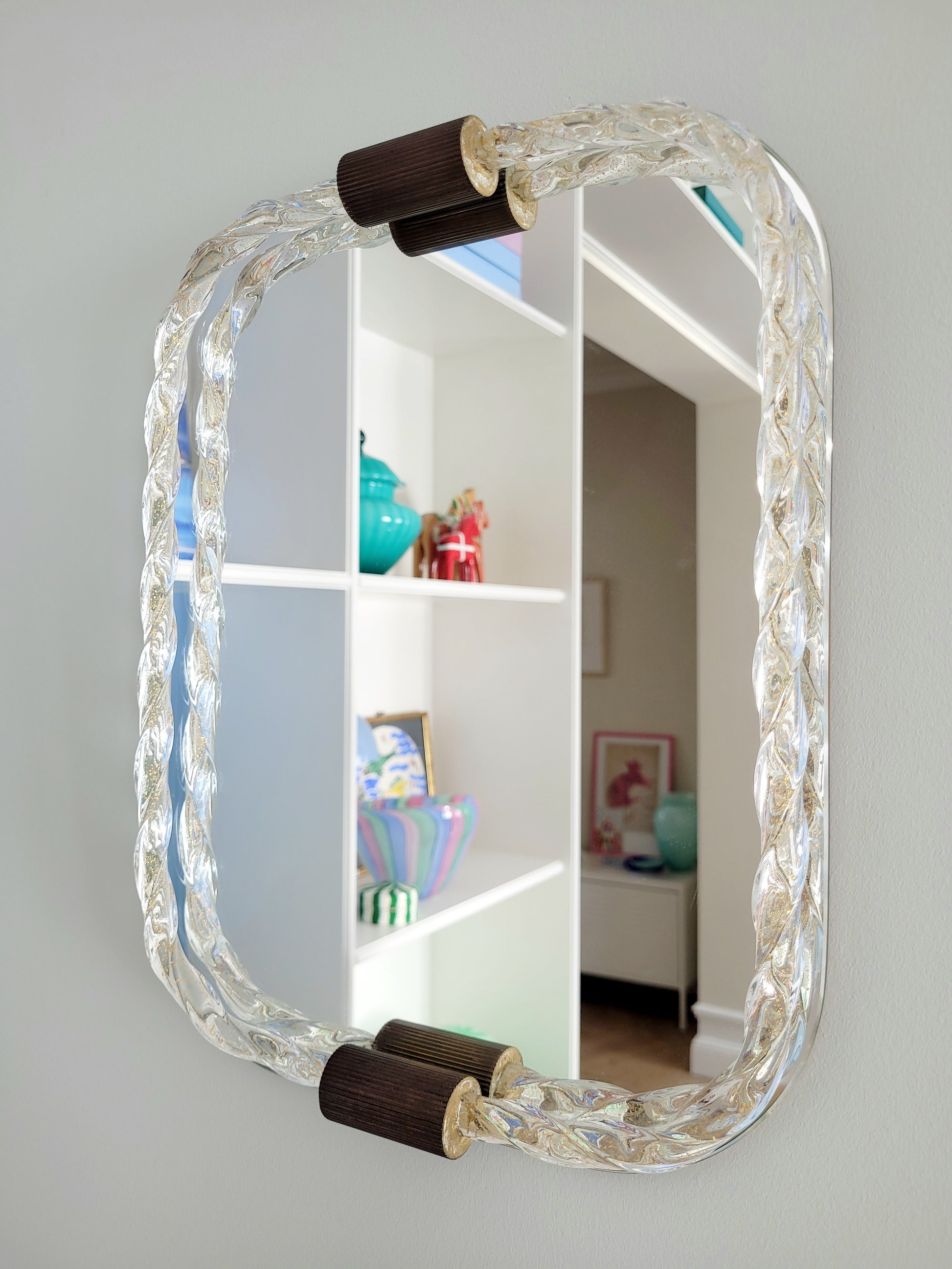 vintage Italian mirror, accentuated by a twisted frame of clear/golden Murano glass