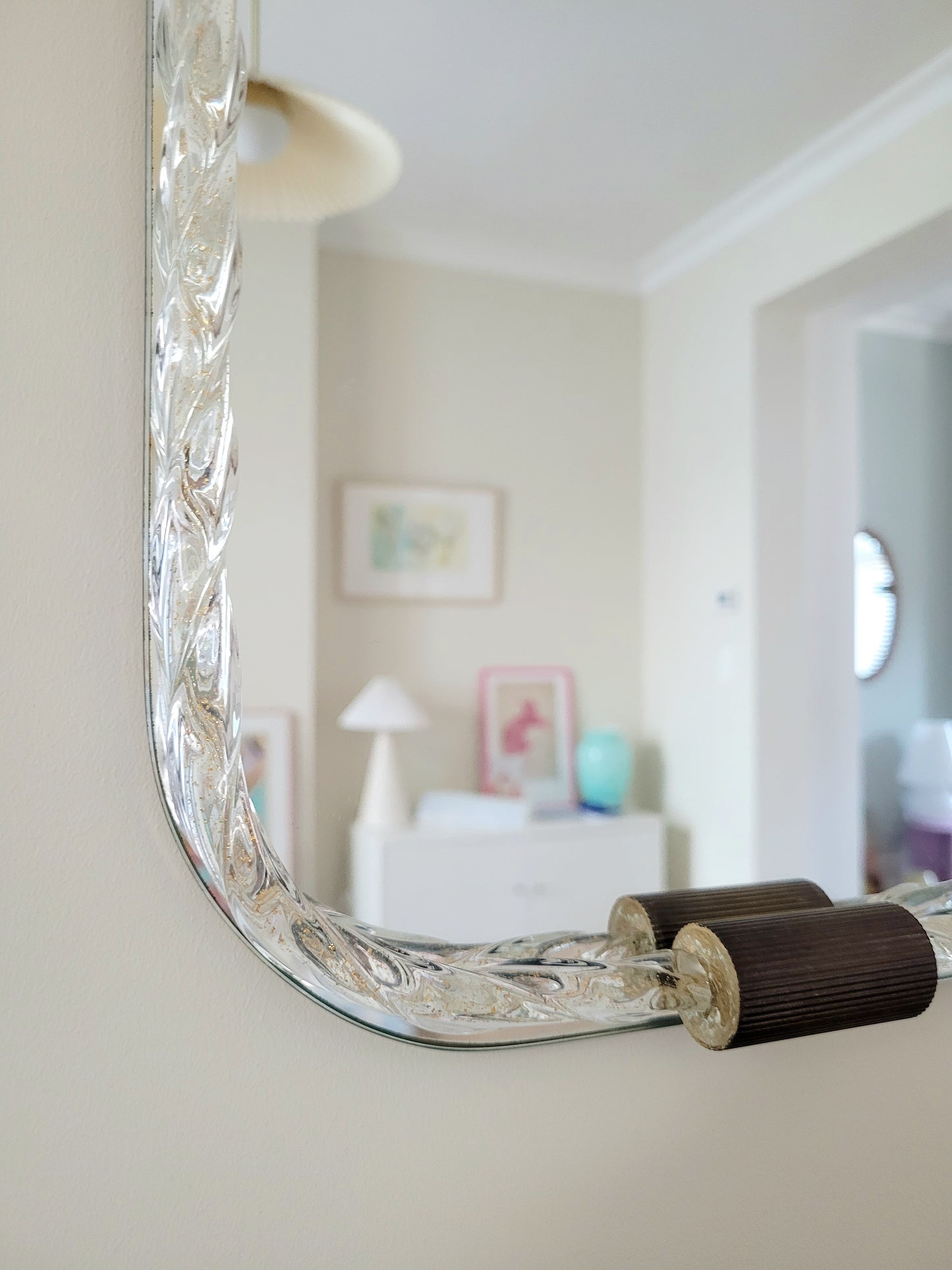 detail of a vintage Italian mirror, accentuated by a twisted frame of clear/golden Murano glass