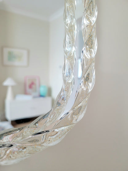 vintage Italian mirror, accentuated by a twisted frame of clear/golden Murano glass