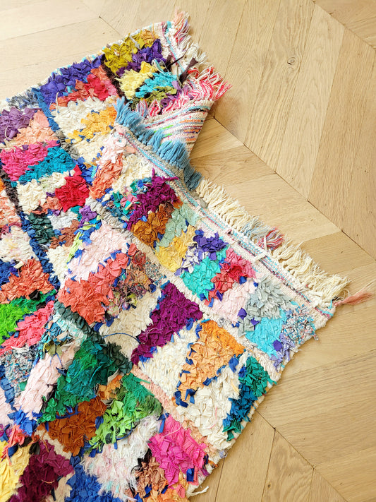 top view of a handwoven Boucherouite rug featuring vibrant colours