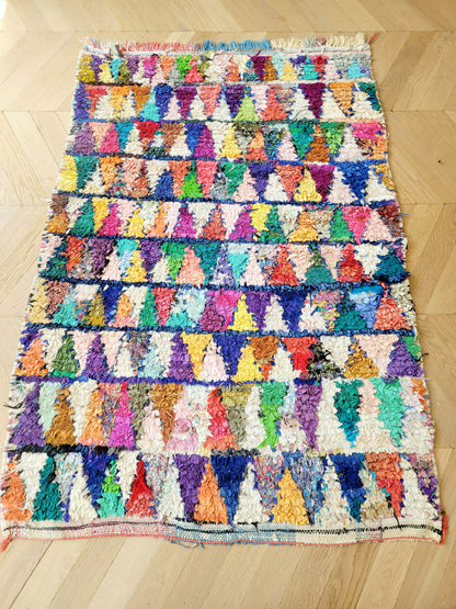 top view of a handwoven Boucherouite rug featuring vibrant colours