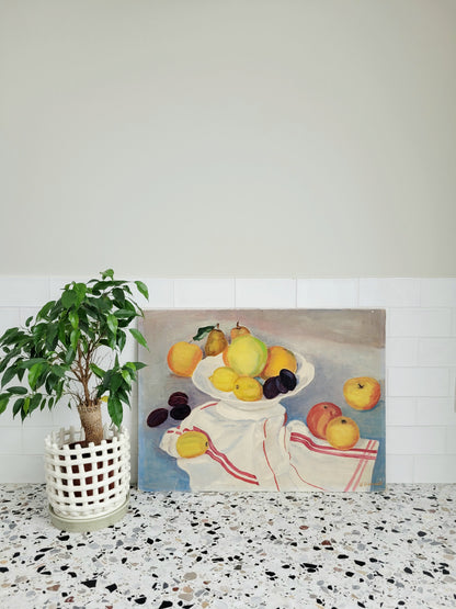 oil painting with still life of a fruit bowl on a  tea towel, placed on a terrazzo kitchen top