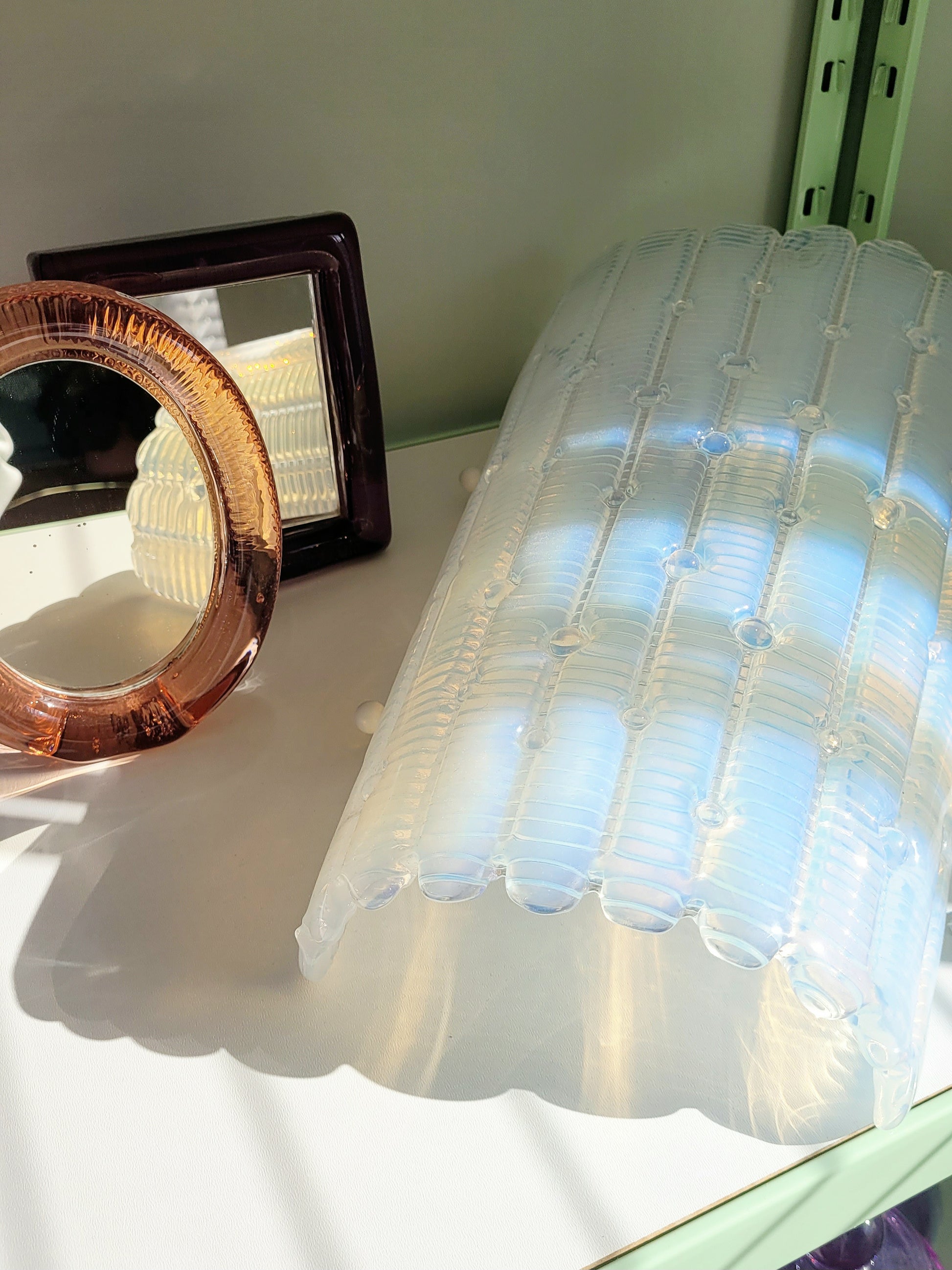 detail of an opalescent Murano glass wall light