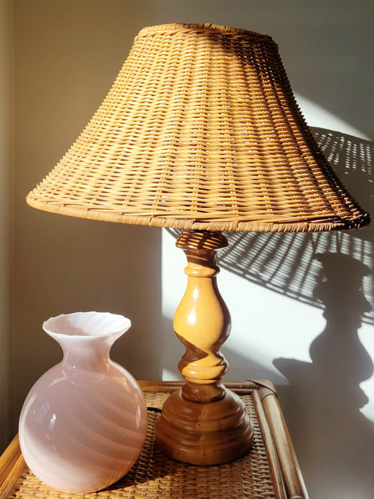 front view of a vintage rattan table lamp with wooden base