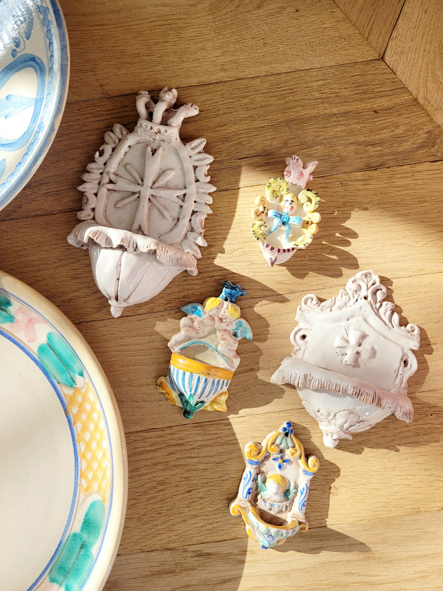 top view of a set of five dainty looking Italian "acquasantiere" (holy water fonts)