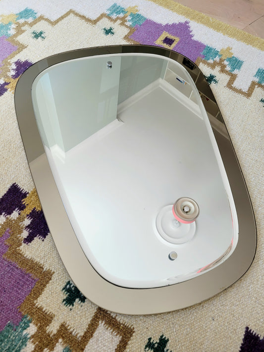  top view of a two-tone Italian mirror featuring smoked glass edging 