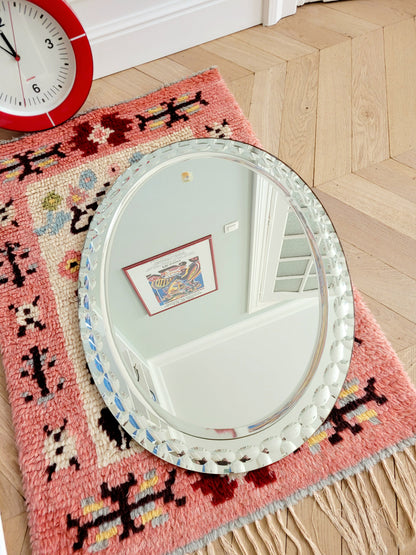 top view of a vintage silver Italian faceted mirror